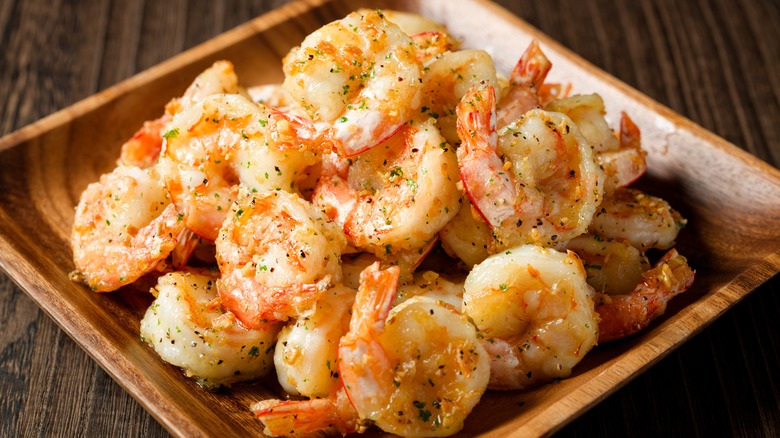 Pile of broiled shrimp on a plate