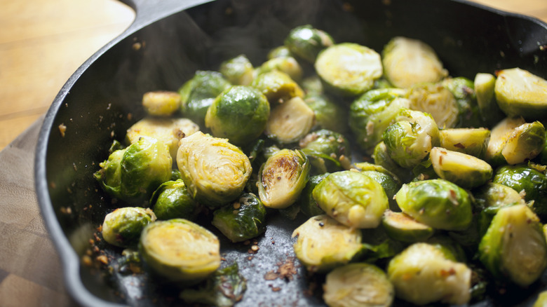 Sautéed brussel sprouts in a cast iron pan