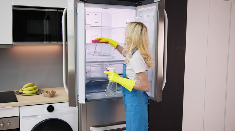 Person cleaning out refrigerator