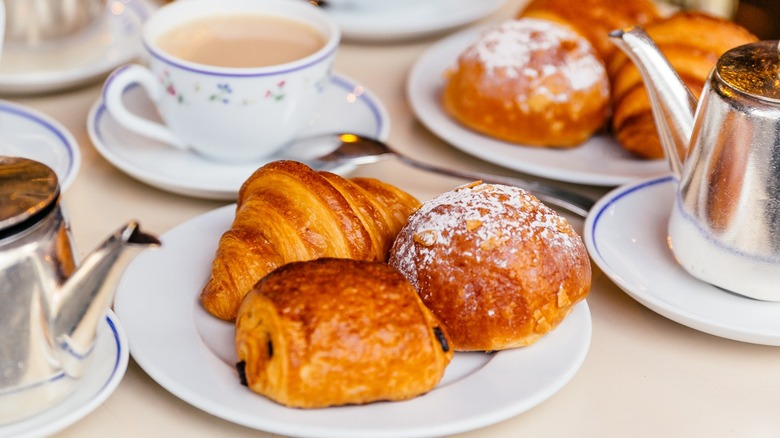 Pain au chocolat and coffee on table