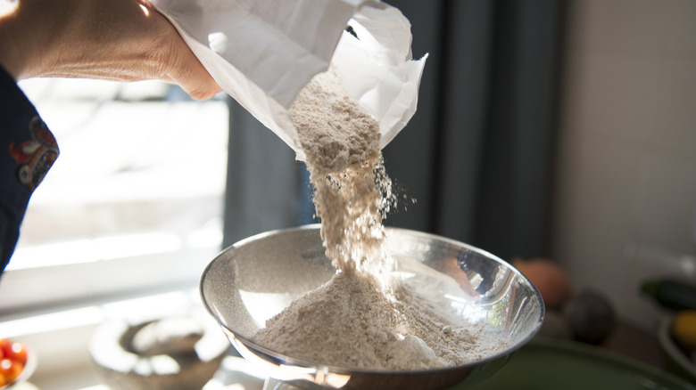 Pouring flour into a bowl