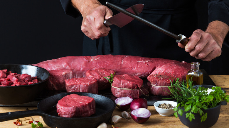 Chef preparing a beef tenderloin