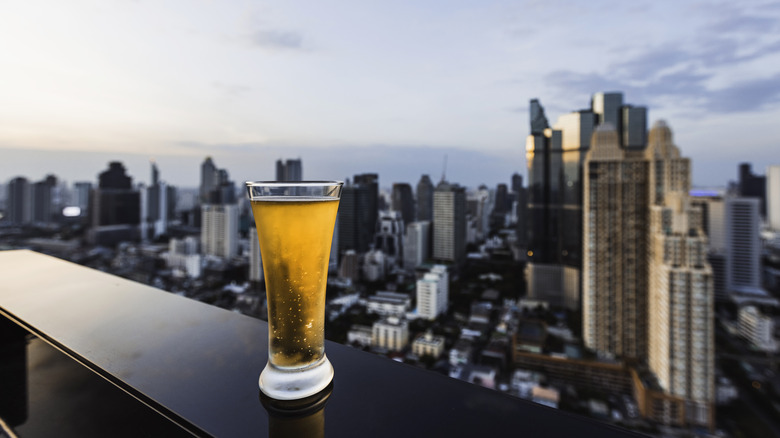 Beer glass and city skyline