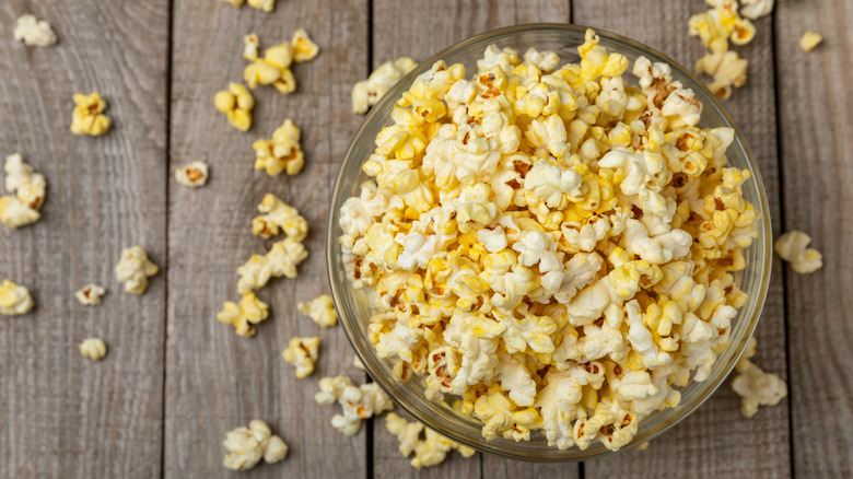 Bowl of popcorn on a wooden background