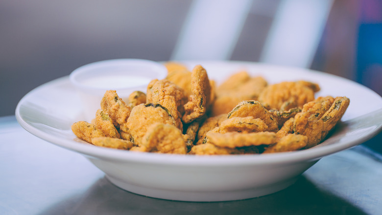 fried pickles in white bowl
