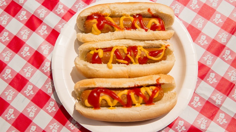 three hot dogs on plate