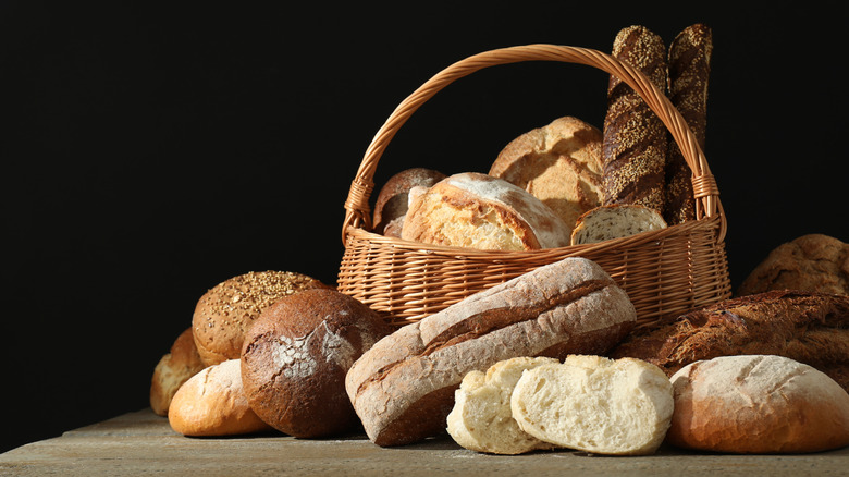 Various loaves of bread arranged on table