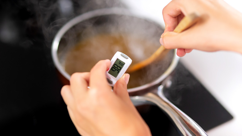 Person using a digital candy thermometer