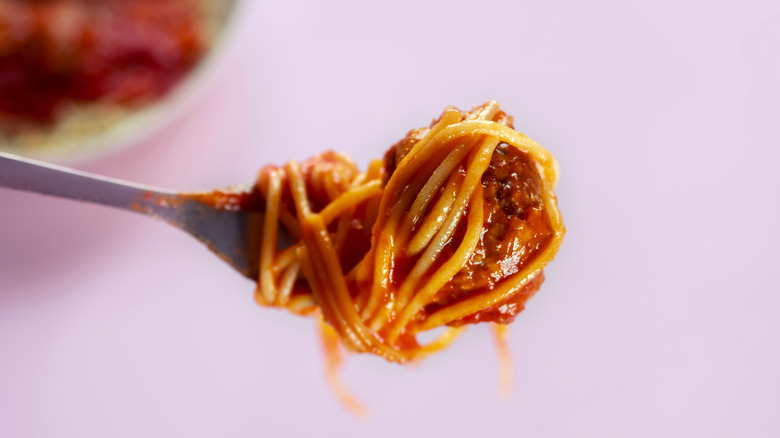 spaghetti sauce pink background