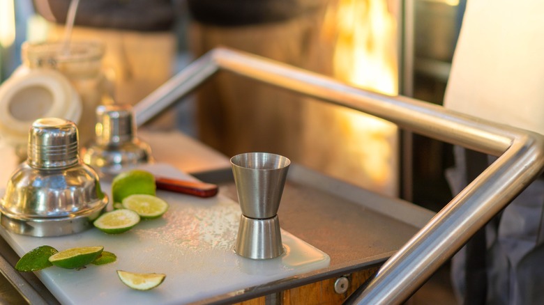 Cocktail ingredients on bar cart