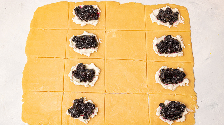 Pieces of rolled dough filled with cream cheese