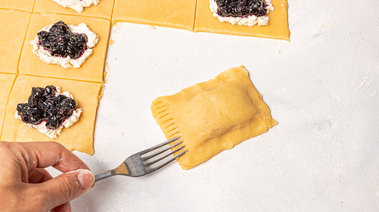 Sealing the ends of a Pop-Tart with a fork