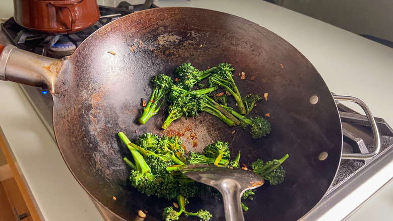 Broccolini with soy and oyster sauce in wok