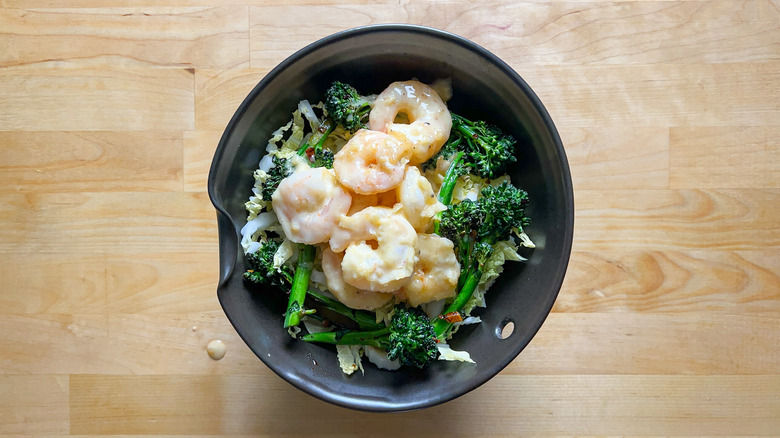 Shrimp in honey mayonnaise sauce with broccolini and Napa cabbage in serving bowl