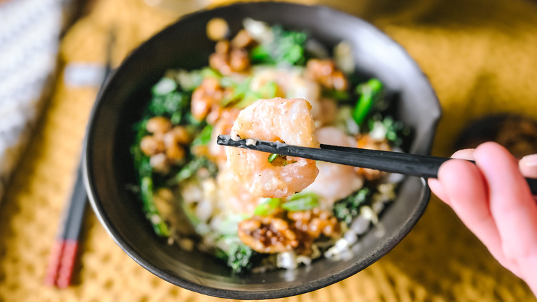 Honey walnut shrimp in chopsticks