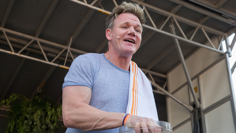 Gordon Ramsay giving a cooking demonstration at an event