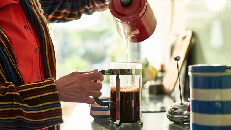 pouring water into French press