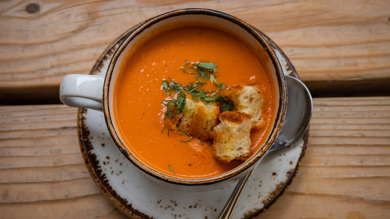 bowl of creamy tomato soup with croutons