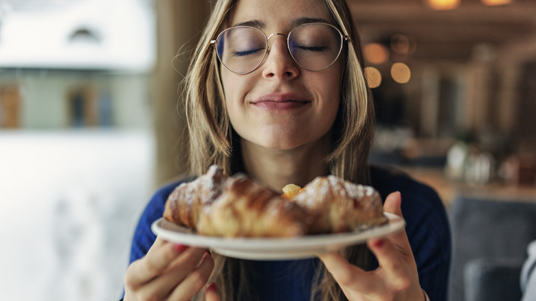 Woman smelling baked goods