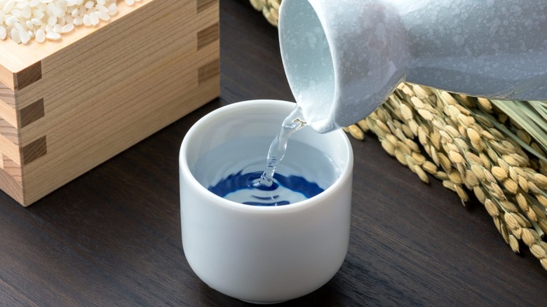 Pouring sake into cup