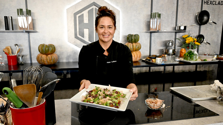 Antonia Lofaso holding plated salad