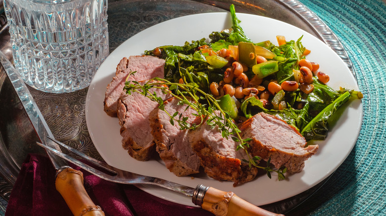 Plate of pork and black eyed peas and greens