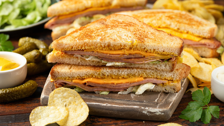 Fried bologna sandwich with cheese and chips