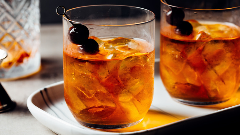 bourbon cherries garnishing two cocktails