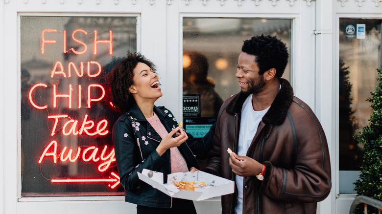 people enjoying fish and chips