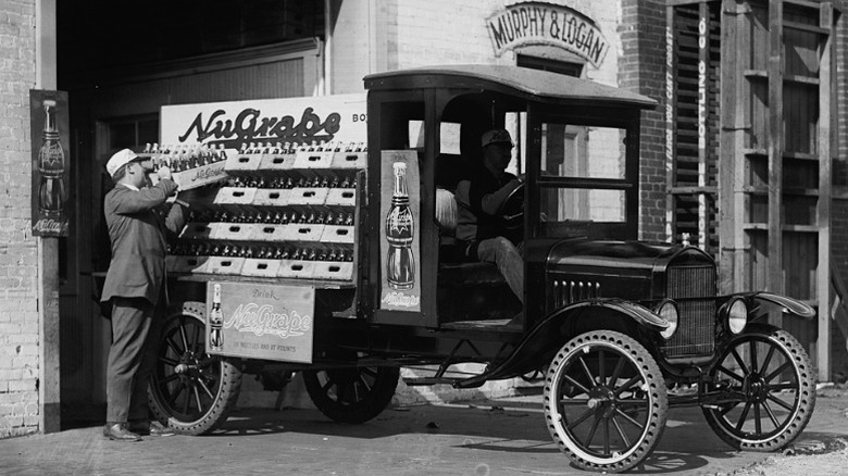 Grape soda being loaded onto a car in the 1920s