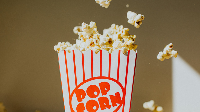 a striped box of movie theater pop corn