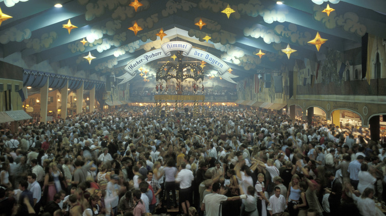 Large Bavarian style beer hall filled with people