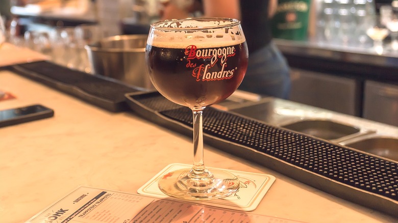 Glass of blended lambic beer on bar