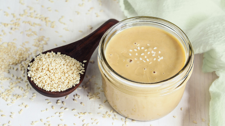 tahini jar and sesame seeds