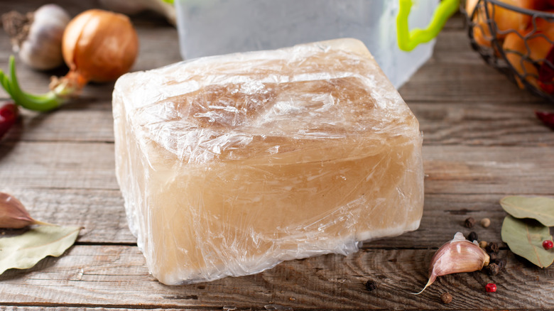 Frozen chicken broth wrapped in a bag