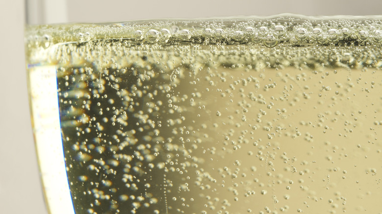 Bubbles within glass of champagne
