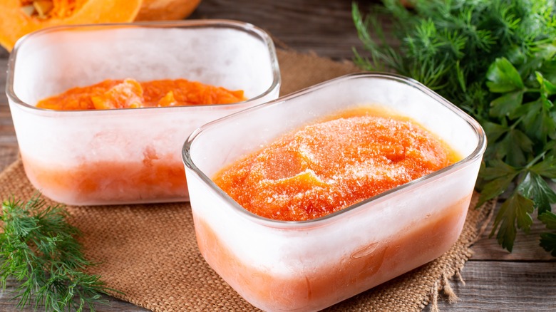 Frozen pumpkin in open glass storage containers