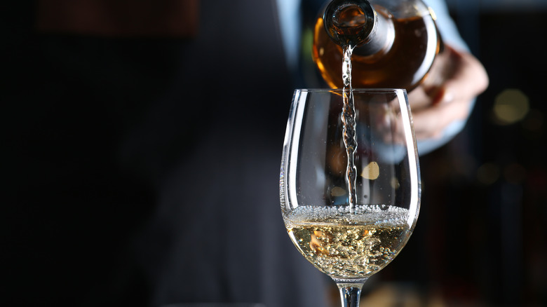 White wine being poured into glass