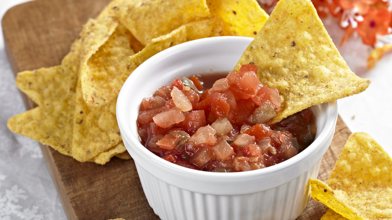 Chip dipped in salsa 
