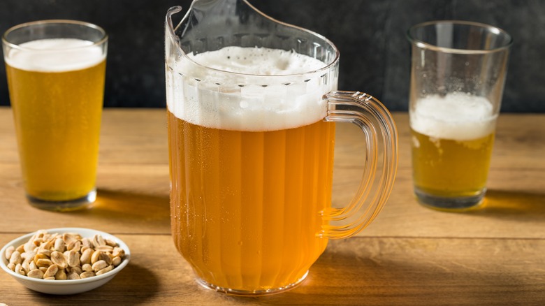 Beer pitcher with beer glasses