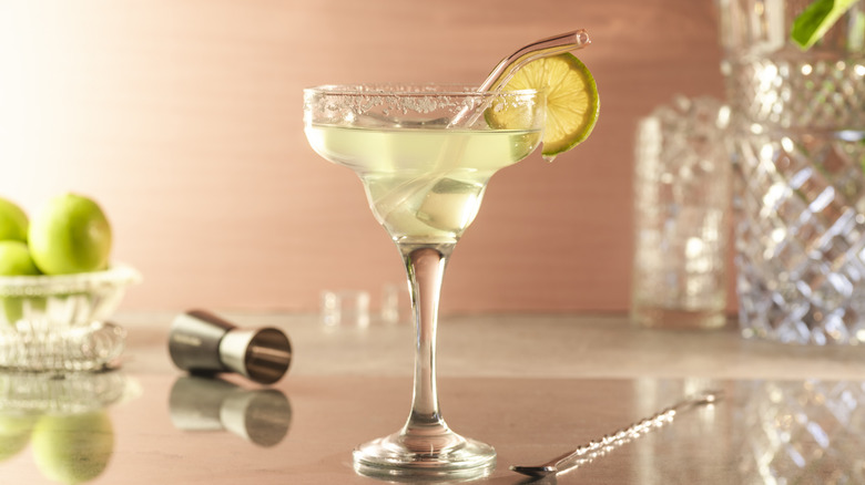A margarita beautifully presented with a lime circle.