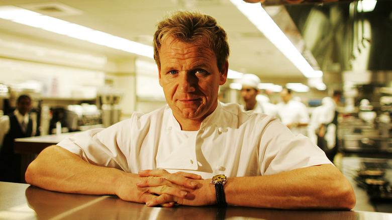 Gordon Ramsay leaning on a kitchen pass.