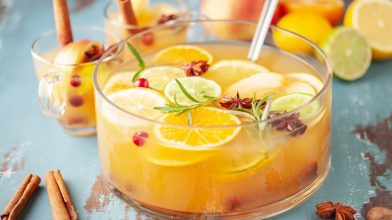 Boozy punchbowl with fruit and glasses