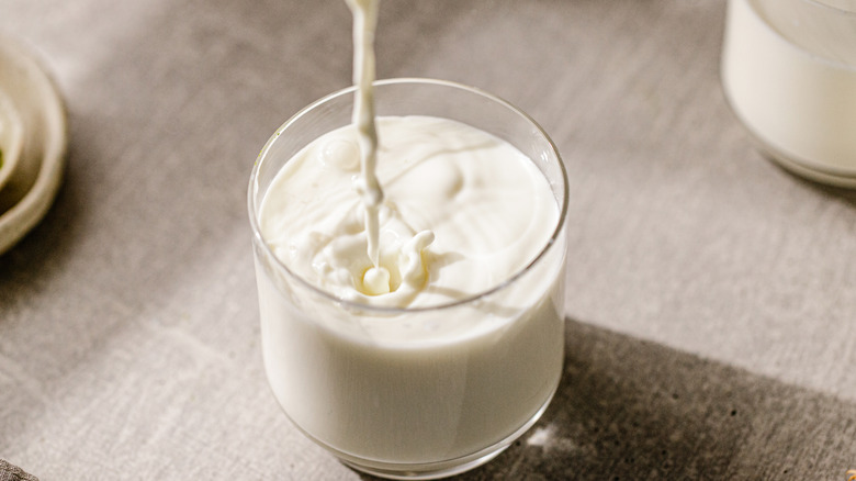 milk being poured into glass