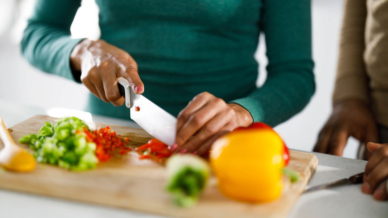 A woman chopping vegetables