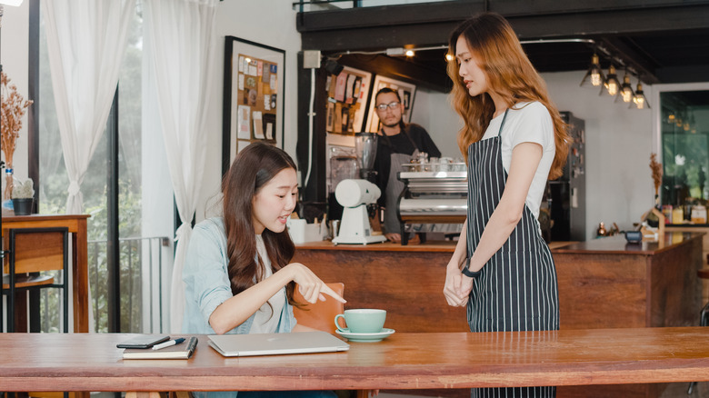 A woman complains about her coffee