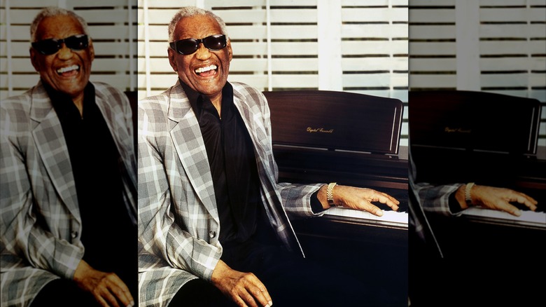 Ray Charles poses with his piano