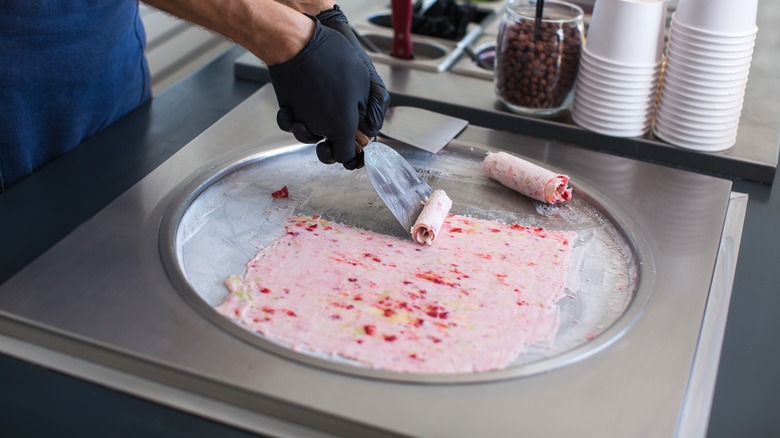 making rolled ice cream on freezer plate