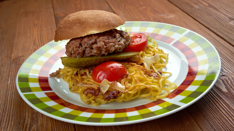 Chow mein sandwich on a plate.