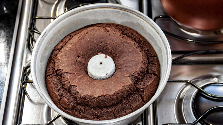 Baked bundt cake resting on a stovetop